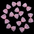 Set of ten pink mesh bow accessories with center ties for hair clips and toy dolls - Pink