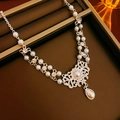 Detail of vintage palace style necklace with teardrop pearl and crystals on tray - Rhinestone Pearl Waterdrop Pendant Style