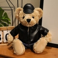 Cute teddy bear in a black faux leather jacket and hat on a rustic wooden desk - Black Zirconia Set / 28cm