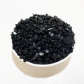 Polished small black crystal quartz chips in a white ceramic bowl for home decor - Obsidian