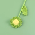 Handmade crochet sunflower with green petals and yellow center on green background - Green Daisy Bouquet