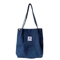 Dark blue corduroy tote bag with long straps and feather label in a variant view - Denim Blue