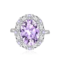 Elegant silver ring featuring a large oval purple gemstone surrounded by sparkling diamonds - Adjustable Open / Purple Zirconia