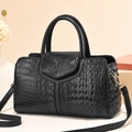 Chic black crocodile-pattern Boston handbag with gold hardware and Y-shaped leather panel - Black