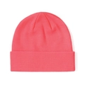Detailed close-up of coral pink ribbed knit beanie showing fine fabric texture and fold - Coral Red