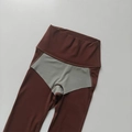 Detail of high-waisted yoga leggings showing the seamless stitching and grey gusset design - Chestnut Brown