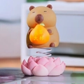 Cartoon Capybara spring head ornament holding a golden lucky bag on pink lotus base - 1188-31B Capybara