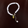 Vintage irregular freshwater pearl bracelet with a cute gold pineapple pendant for women - Playful Pearl Yellow Pineapple Pendant Style
