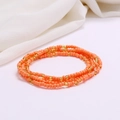 Detail of layered orange and gold seed bead bracelets with elastic beach jewelry style - #30(Orange Gold)