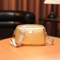Golden woven crossbody camera bag with wide beige strap and polished gold hardware - Plaid Gold