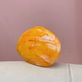 Detailed close-up of amber marble texture acrylic bag with vibrant yellow and orange tones - Orange