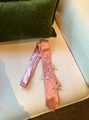 Detail shot of the elegant pink satin bow tie necklace featuring delicate ribbon bows - Bowknot Necktie Style / Pink