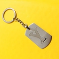 Brushed stainless steel keychain featuring a hollow-out letter Y pendant on yellow background - Letter Y