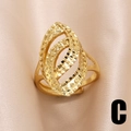 Elegant gold-plated irregular oval hollow ring with textured layers on satin background - Hollow Oval Nested Style (C)