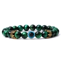 Detailed view of green tiger eye beads with evil eye and gold crown charms bracelet - Green Tiger Eye (06)