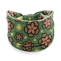 Elastic headband featuring green African floral print and geometric knotted design - Style 83