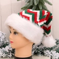 Knitted Christmas hat with red green ripple pattern and plush pompom on a model - Luxury Knitted Hat [Green Red White]