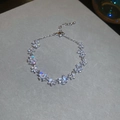 Macro shot of silver butterfly bracelet featuring marquise-cut zircons and adjustable chain - Silver Butterfly