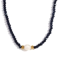 Beaded necklace featuring dark blue faceted crystals and a single white freshwater pearl - Royal Blue Plated