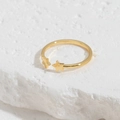 Polished golden open ring featuring dual star design on a white stone background - Star Open Ring / Gold