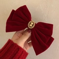 Detail of red velvet bow hair clip featuring a vintage gold portrait cameo centerpiece - Red Velvet Vintage Cameo Clip