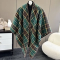 Detail of green plaid poncho scarf with thick knit texture and lock-stitched edges - Plaid Green