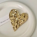 Golden heart-shaped metal jewelry tray with textured hammered finish on white plate - 4# Gold Heart Shape Brooch