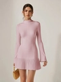 Close-up of pink long-sleeve knit dress with elegant pleated hem and fine fabric texture - Pink