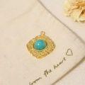 Close-up of vintage gold pendant with turquoise stone on a linen pouch with flowers - Pendant Only (Without Chain)-Embossed Floral Green Stone (SAC23061910)