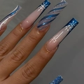 Extra long coffin press-on nails featuring blue snowflakes and silver glitter patterns - Ice Blue Winter Snowflake Glitter Style (AW508)