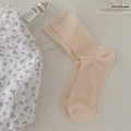 Beige ribbed knit mid-calf socks for women in minimalist aesthetic lifestyle setting - One Size / Light Pink