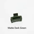 Detail view of the matte dark green hollow rectangular hair claw clip with multi-tooth grip - Matte Dark Green