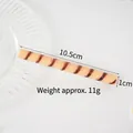 10.5cm artificial PVC wafer roll stick in light orange with brown spiral patterns - Orange Striped Chocolate Stick