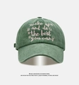 Detail of washed green vintage baseball cap with white embroidered inspirational text - Adjustable / Dark Green