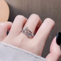 Macro detail of silver nail ring with purple and white zircon stones on woman hand - Adjustable Open / Purple Zircon Nail Shape (JZ3322)