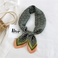 Olive green silk twilly scarf with geometric floral print and orange border as a bow - Checkered Flowers Orange Edge