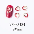 Détail de charmes à ongles cœur rouge avec base dorée et dimensions 9x9mm - Cœur 3D (AJ84)