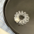 Transparent spiral phone cord hair tie with pearl accent on a black tray - 1 Pearl Style / Clear White