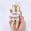Vue détaillée d'un flacon de 2g de paillettes d'or pour décoration de gâteaux et DIY - Grand Pot / Feuille d'or