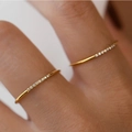 Slim gold plated titanium steel rings with cubic zirconia crystals worn on fingers - 8-Stone Gold