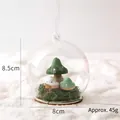 Christmas glass dome ornament featuring three colorful mushrooms on green moss base - Hanging Glass Ball - Mushroom B (45g)