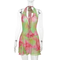 Detail van lichtgroene mesh mini-jurk met bloemenprint, halternek en open rug - XS / Groen