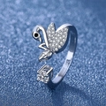 Silver swan ring featuring sparkling cubic zirconia stones on a shimmering blue background - Swan Ring Ljz-185 / Adjustable Open