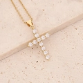 Detailed shot of gold-plated cross pendant with micro-paved zircons on a stone background - Classic Starry Zirconia Cross (8#)