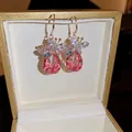 Elegant gold earrings with pink teardrop crystal and colorful butterfly pendant detail - Pink Water Drop Butterfly Ear Hook (耳钩-粉色)