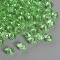 Macro shot of green faceted glass crystal beads with precise center holes for jewelry DIY - 4mm Rondelle Beads 170pcs/Pack / Light Green