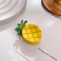 Mini gele ananas haarklem van acetaat met een getextureerd oppervlak en groene bladeren - Ananas