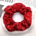 Close-up of a festive Christmas scrunchie with red sequins and white faux fur trim - Sequin Red