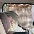 Close-up of brown plaid cotton car sunshade curtain with a cute smiley baby label - Coffee Gingham Smile