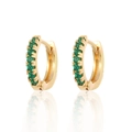 Macro shot of gold hoop earrings set with green round-cut cubic zirconia and mirror reflection - Gold Green Zirconia